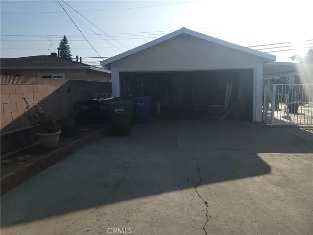 a room with gym equipment and windows