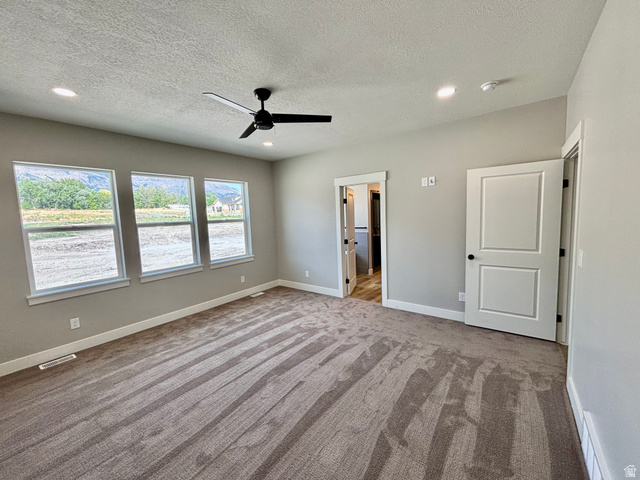 1184 West 3250 North Ogden, UT 84414 - Photo 27 of 69 Master bedroom featuring three large windows, plush carpeting, a contemporary ceiling fan, and recessed lighting