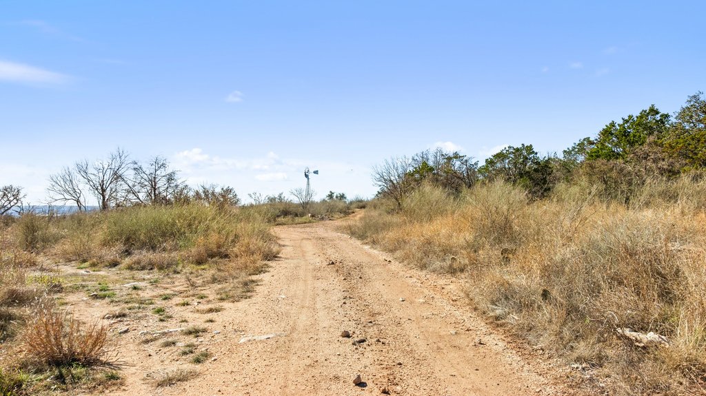 1101 Crider Road Marble Falls, TX 78654 - Photo 22 of 34 View of dirt / gravel road with a rural view