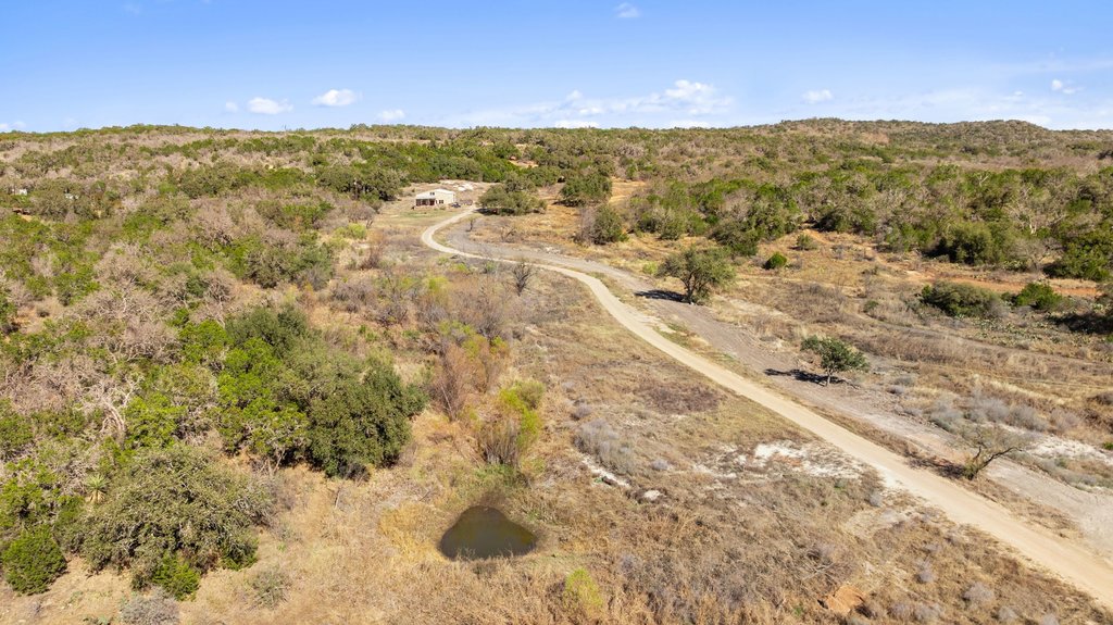 1101 Crider Road Marble Falls, TX 78654 - Photo 28 of 34 Aerial overview of property's location with a heavily wooded area