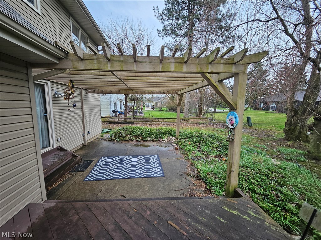16551 Drake Road Strongsville, OH 44136 - Photo 48 of 50 Deck with a yard, a pergola, concrete patio