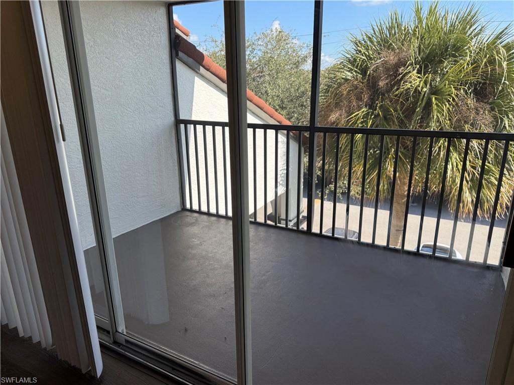 7985 Preserve Circle, Unit 1133 Naples, FL 34119 - Photo 7 of 36 Balcony featuring a sunroom