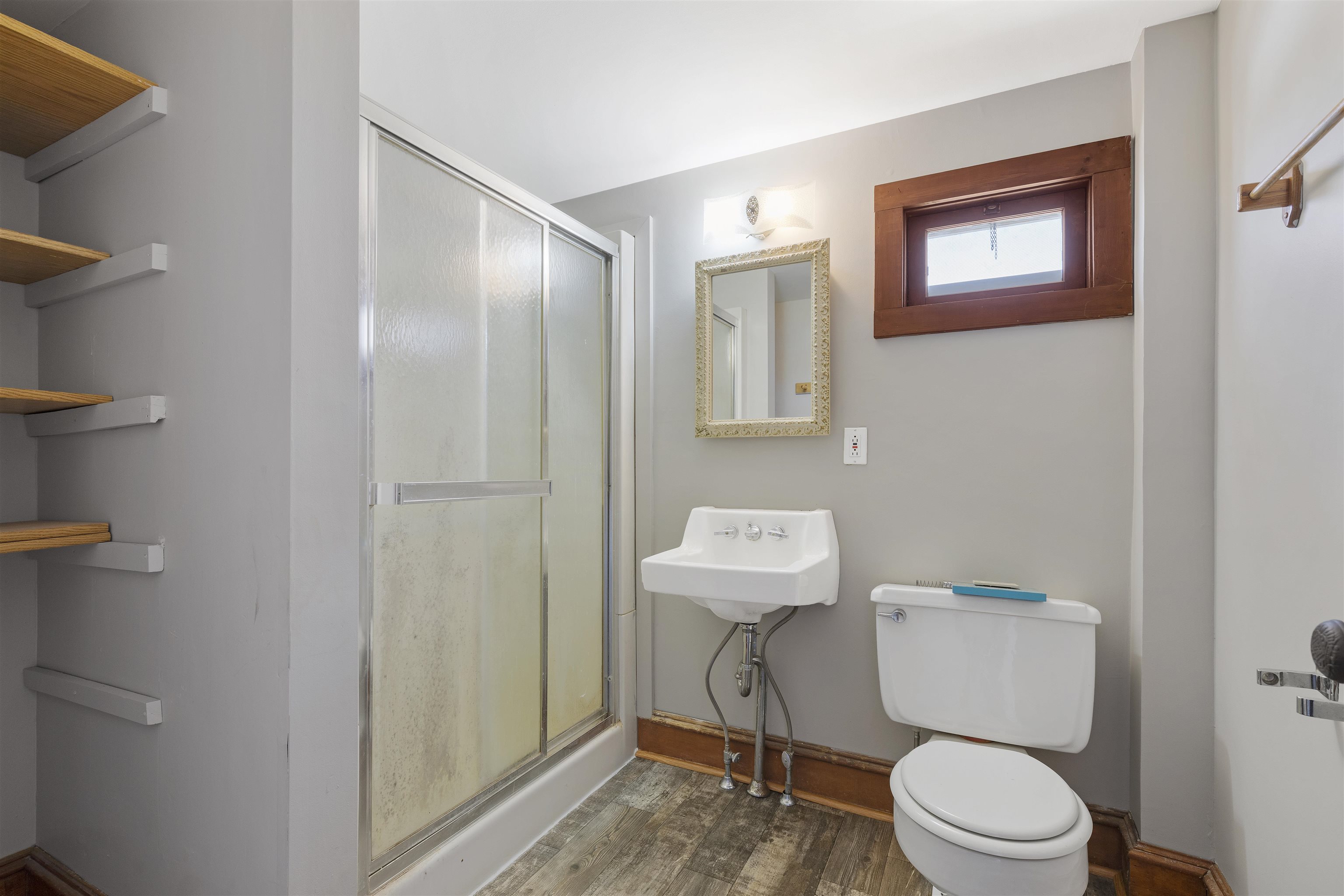 703 North Main Street Rochelle, IL 61068 - Photo 11 of 21 a white toilet sitting next to a bathroom sink