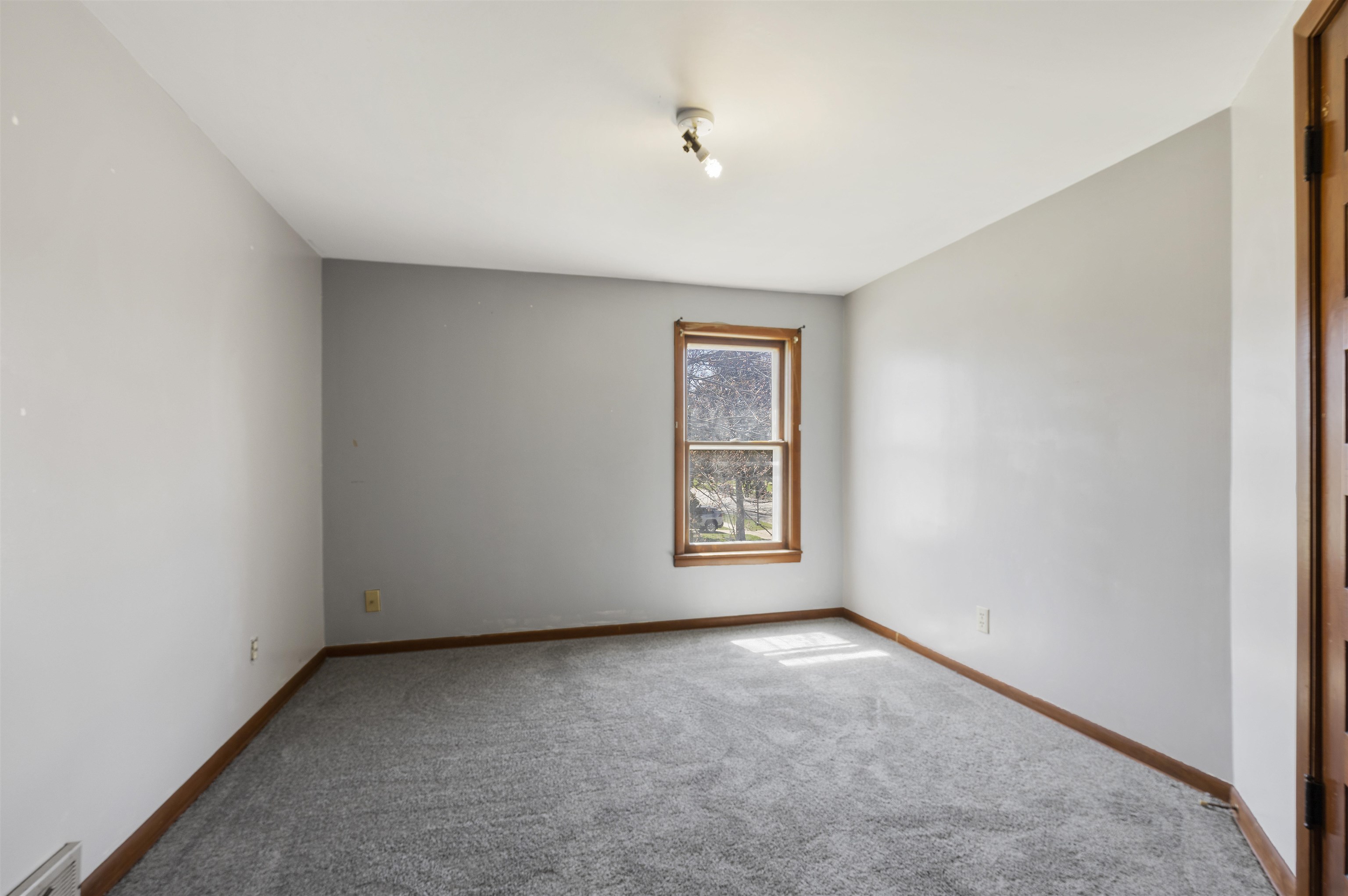 703 North Main Street Rochelle, IL 61068 - Photo 13 of 21 an empty room with windows