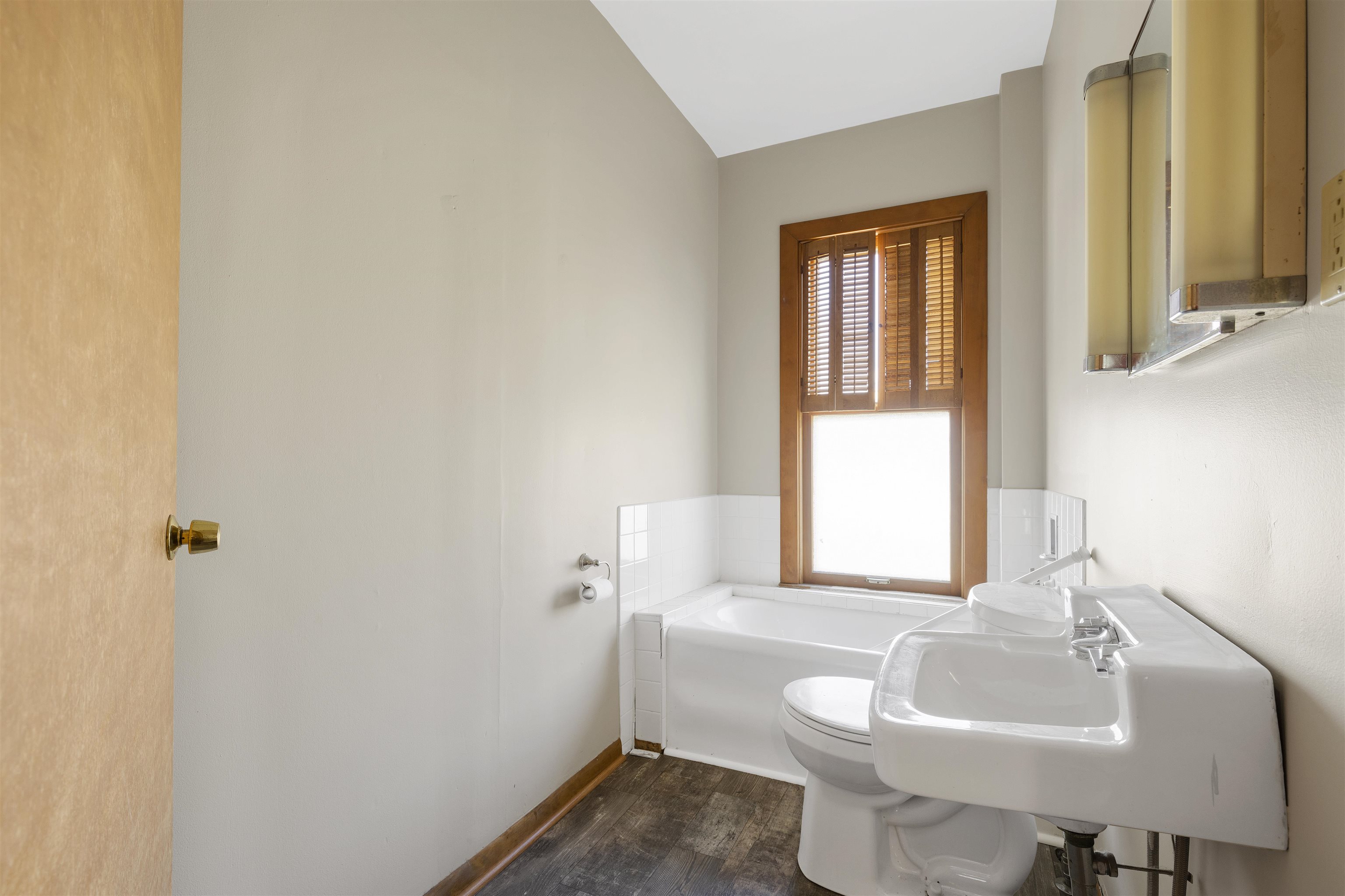 703 North Main Street Rochelle, IL 61068 - Photo 14 of 21 a bathroom with a sink toilet and shower