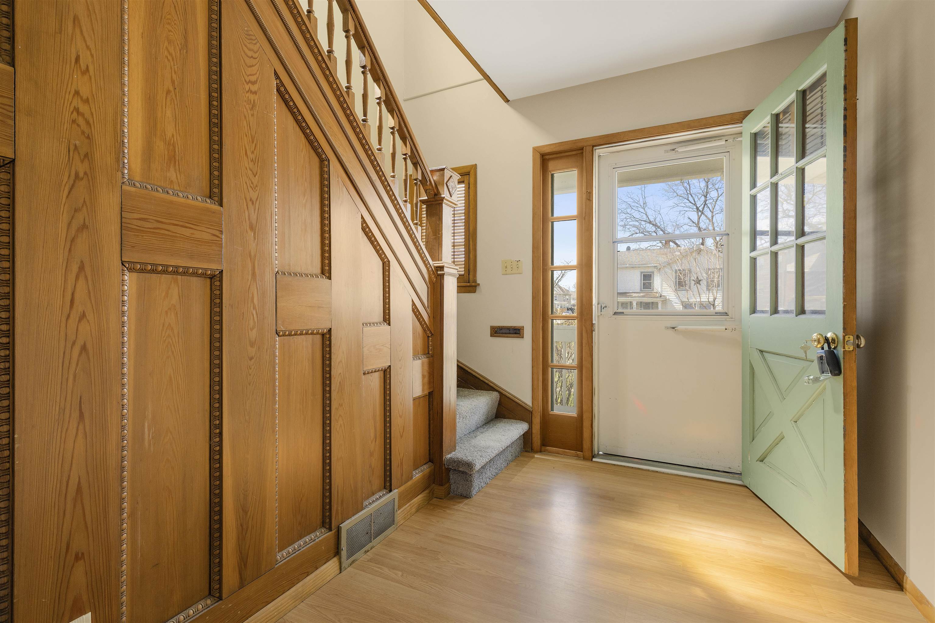 703 North Main Street Rochelle, IL 61068 - Photo 3 of 21 a view of an entryway with staircase