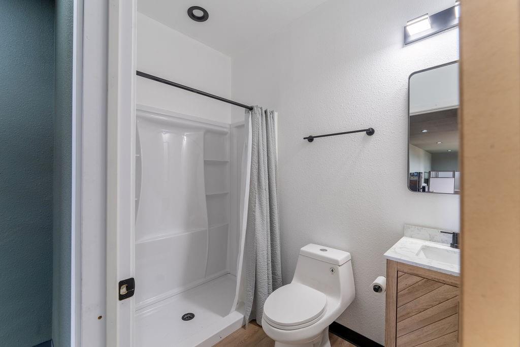 15193 Robin Road Haslet, TX 76052 - Photo 11 of 14 a white toilet sitting next to a bathroom sink