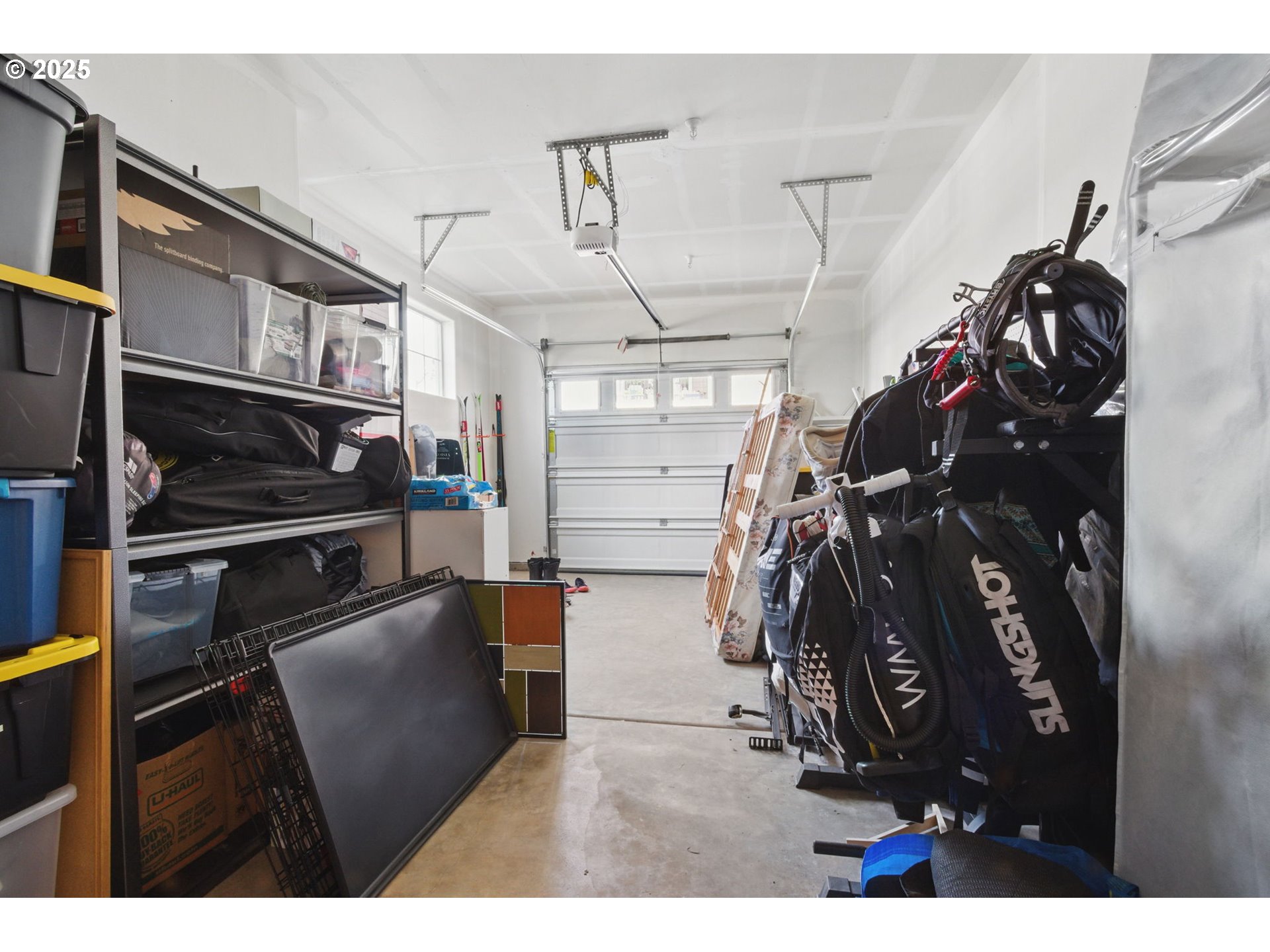 16322 Northwest Chadwick Way, Unit 303 Portland, OR 97229 - Photo 18 of 23 a view of walk in closet with clothes