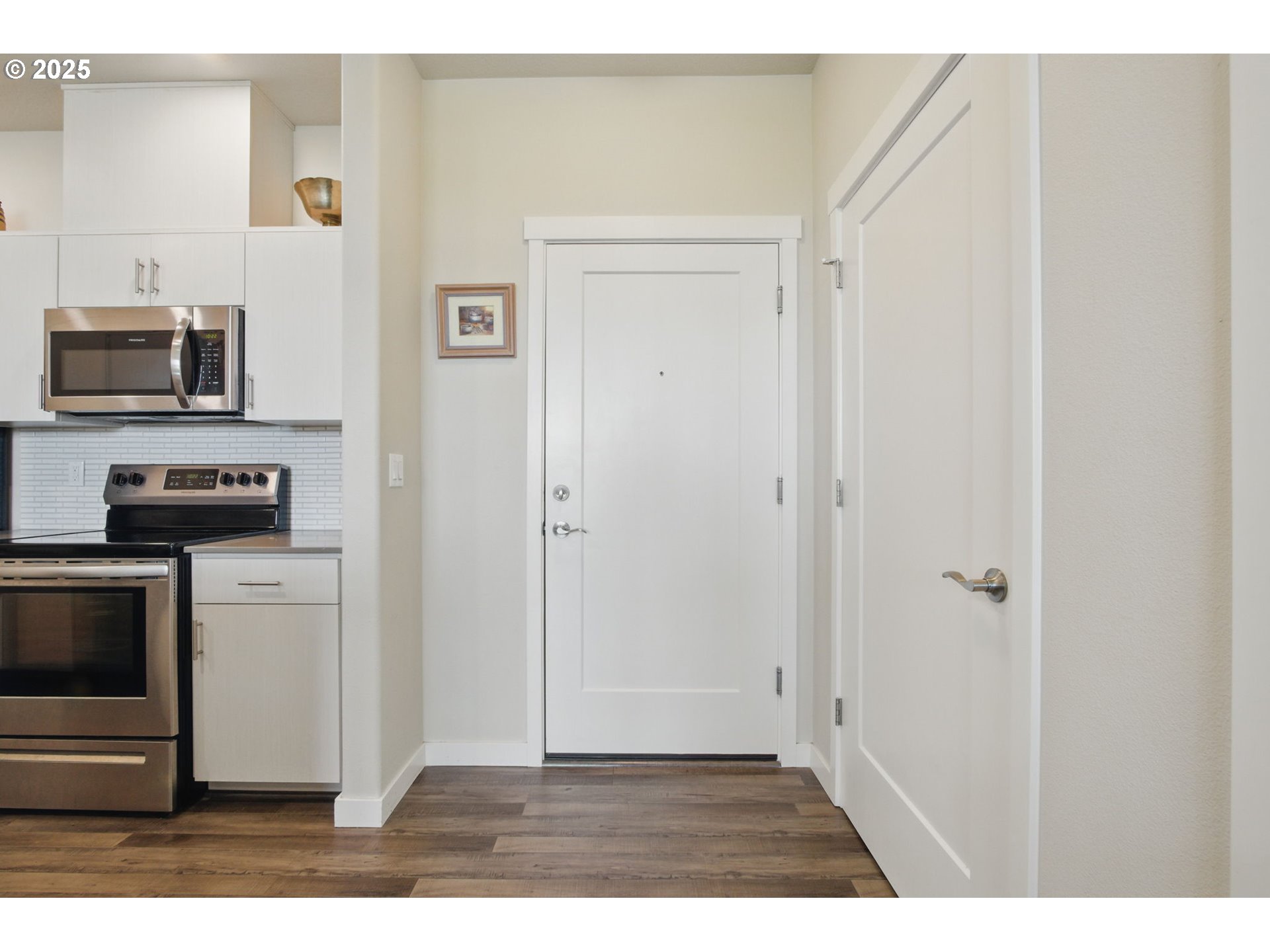 16322 Northwest Chadwick Way, Unit 303 Portland, OR 97229 - Photo 4 of 23 a view of a kitchen from the hallway