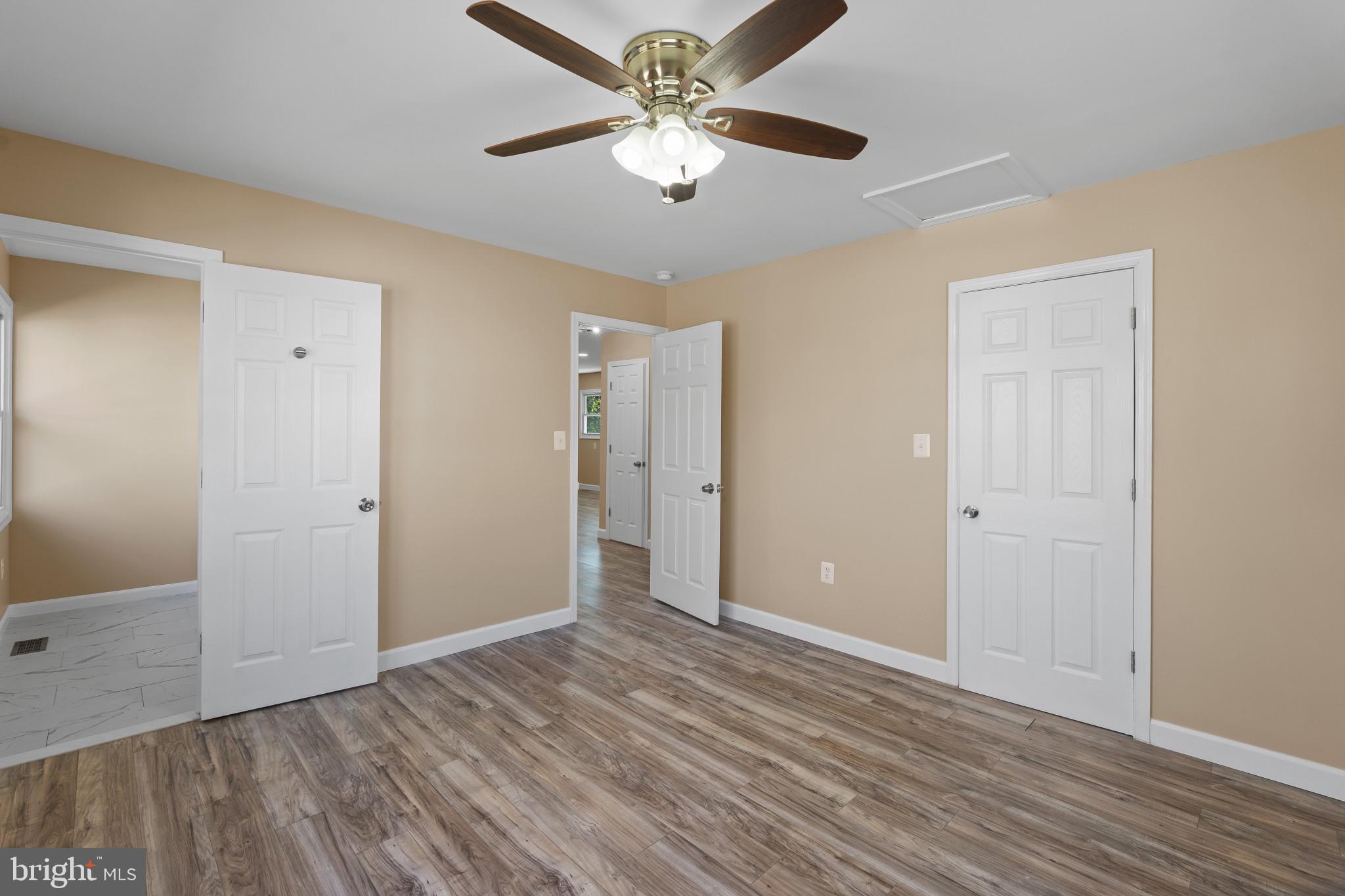 712 Kent Avenue Baltimore, MD 21228 - Photo 12 of 30 a view of an empty room and window a ceiling fan