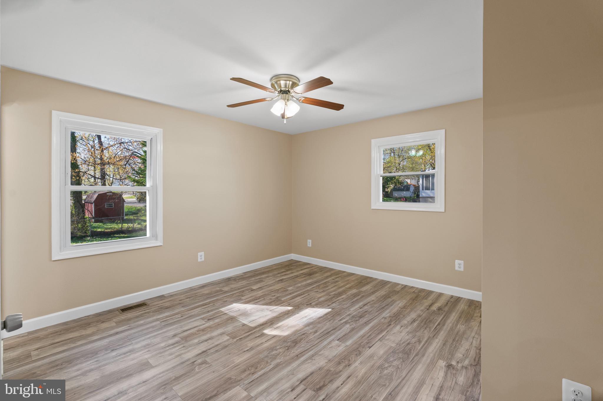 712 Kent Avenue Baltimore, MD 21228 - Photo 14 of 30 a view of empty room with wooden floor