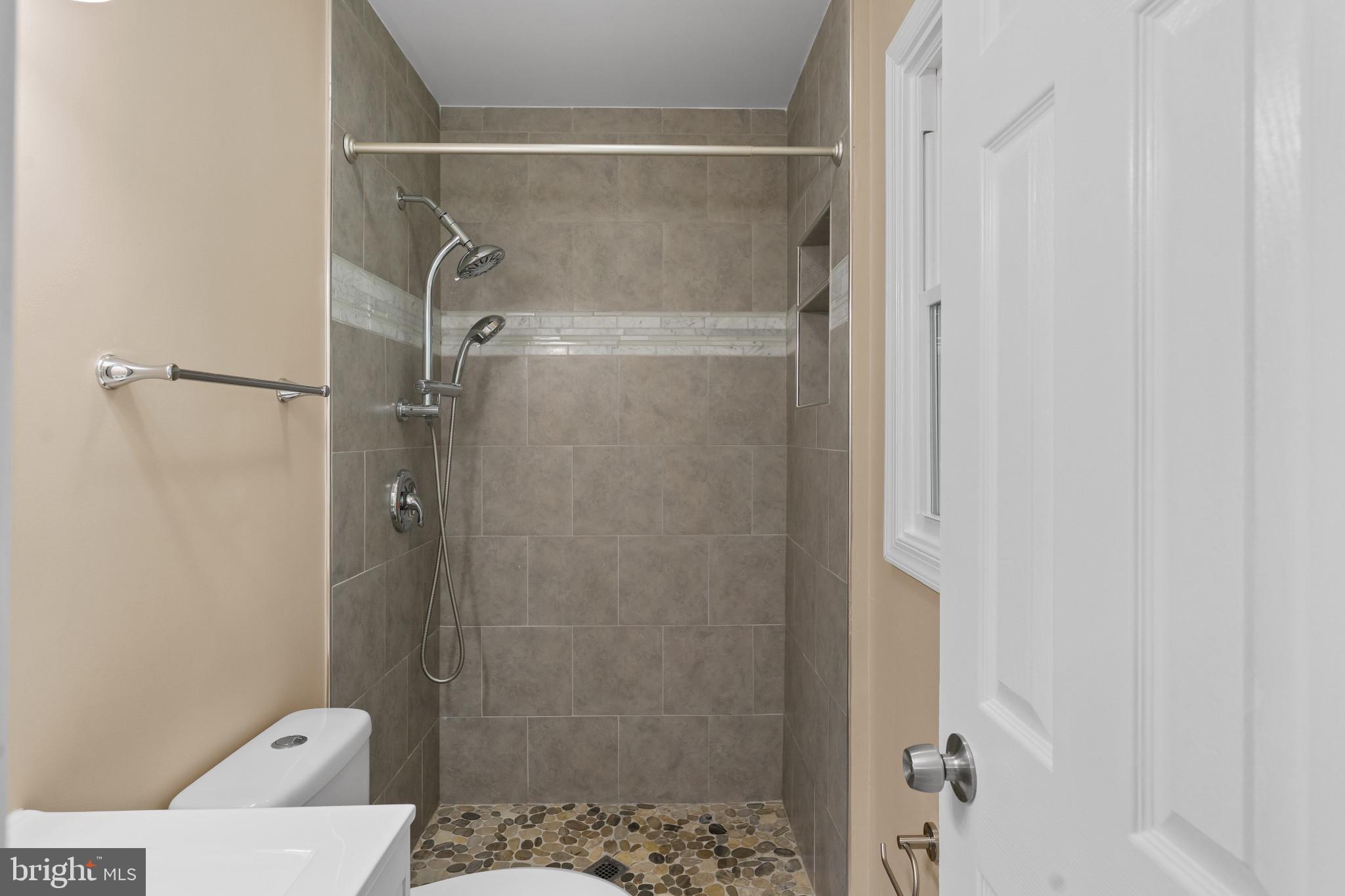 712 Kent Avenue Baltimore, MD 21228 - Photo 16 of 30 a bathroom with a shower