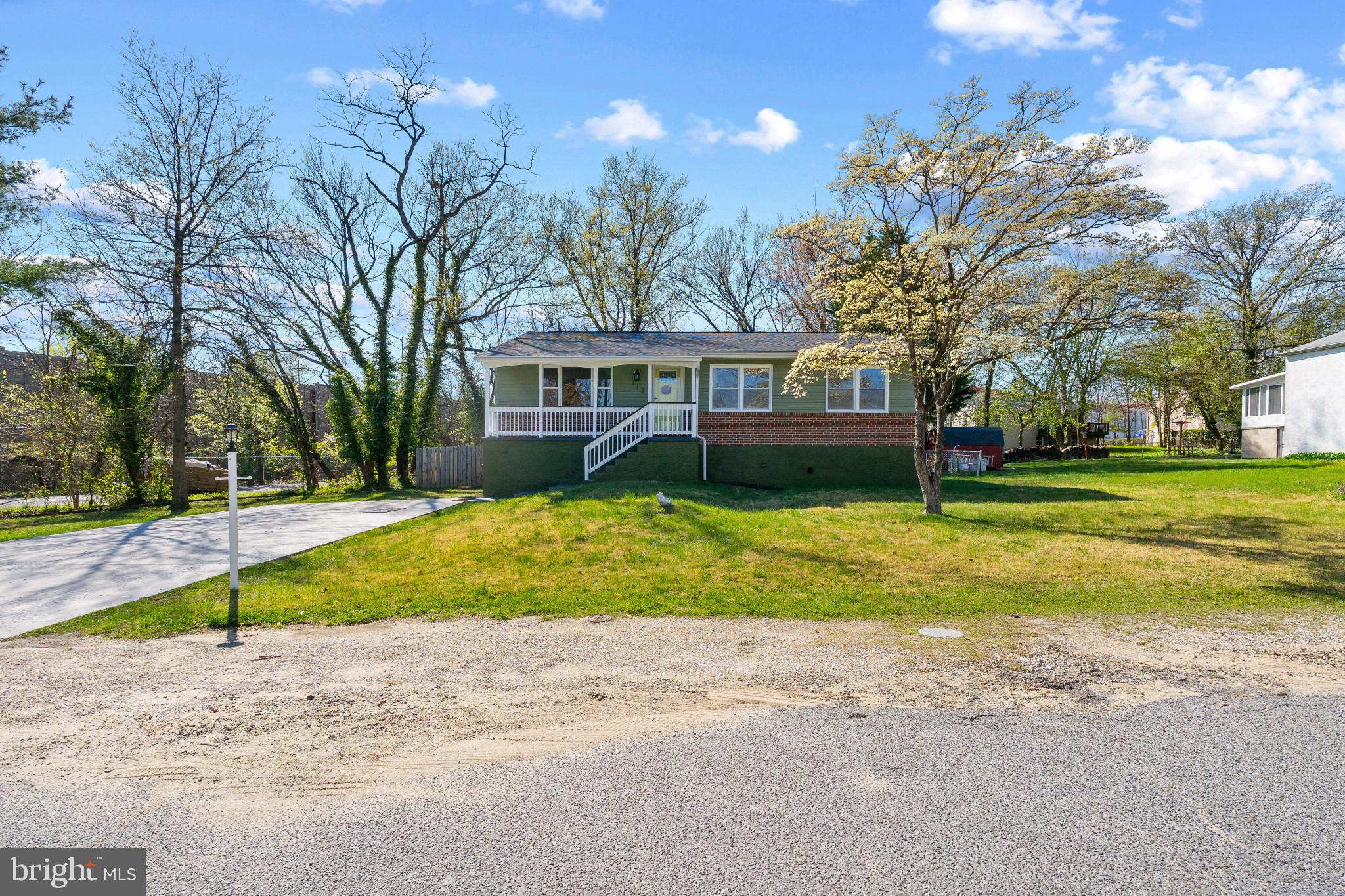 712 Kent Avenue Baltimore, MD 21228 - Photo 2 of 30 a front view of house with yard and green space