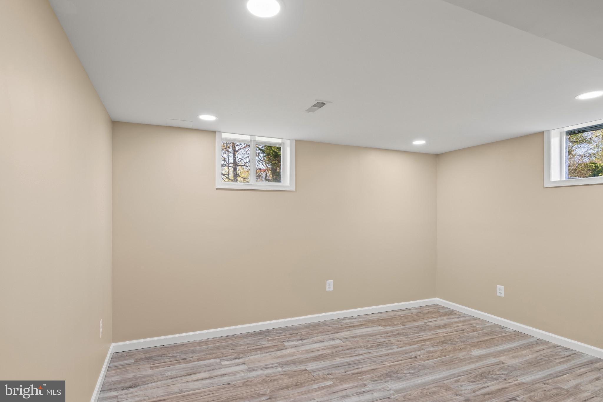 712 Kent Avenue Baltimore, MD 21228 - Photo 24 of 30 a view of an empty room with wooden floor