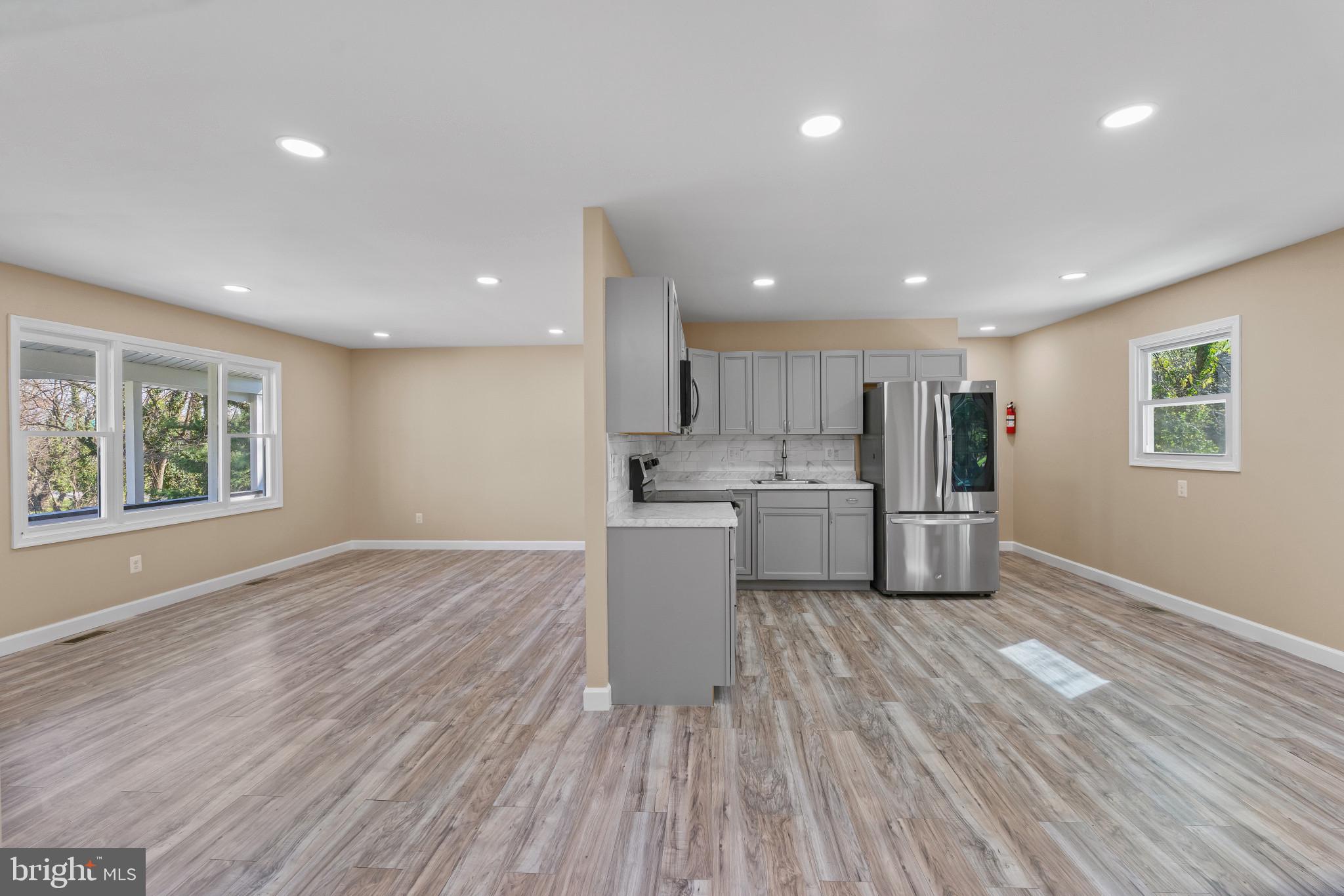 712 Kent Avenue Baltimore, MD 21228 - Photo 7 of 30 a view of kitchen with wooden floor and electronic appliances