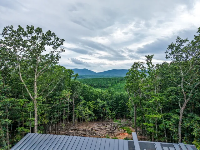a view of balcony with deck and yard