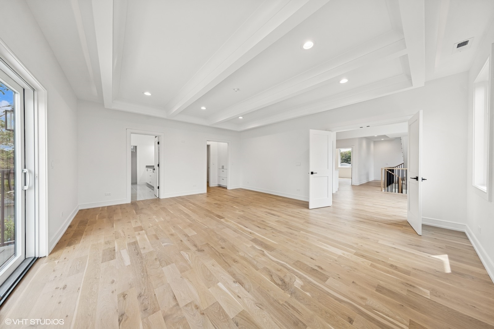 936 Mitchell Avenue Elmhurst, IL 60126 - Photo 13 of 44 a view of a big room with wooden floor and a bathroom