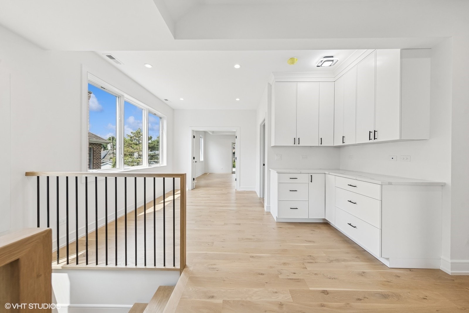 936 Mitchell Avenue Elmhurst, IL 60126 - Photo 19 of 44 a view of a kitchen with white cabinets
