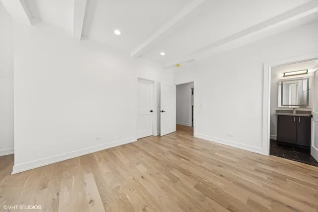 a bathroom with a granite countertop sink toilet a large mirror a bathtub and shower