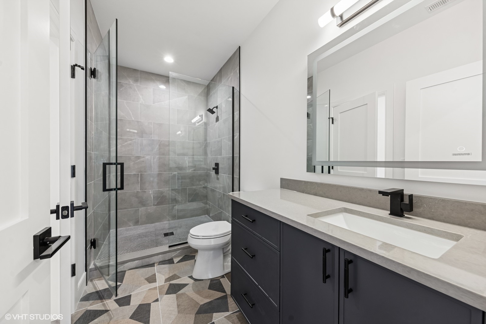 936 Mitchell Avenue Elmhurst, IL 60126 - Photo 25 of 44 a bathroom with a sink a toilet and shower