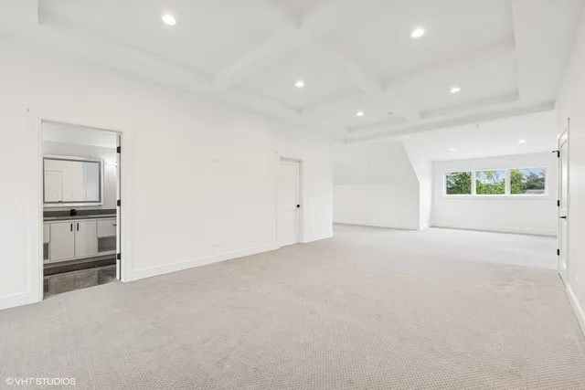 an empty room with a empty space and windows