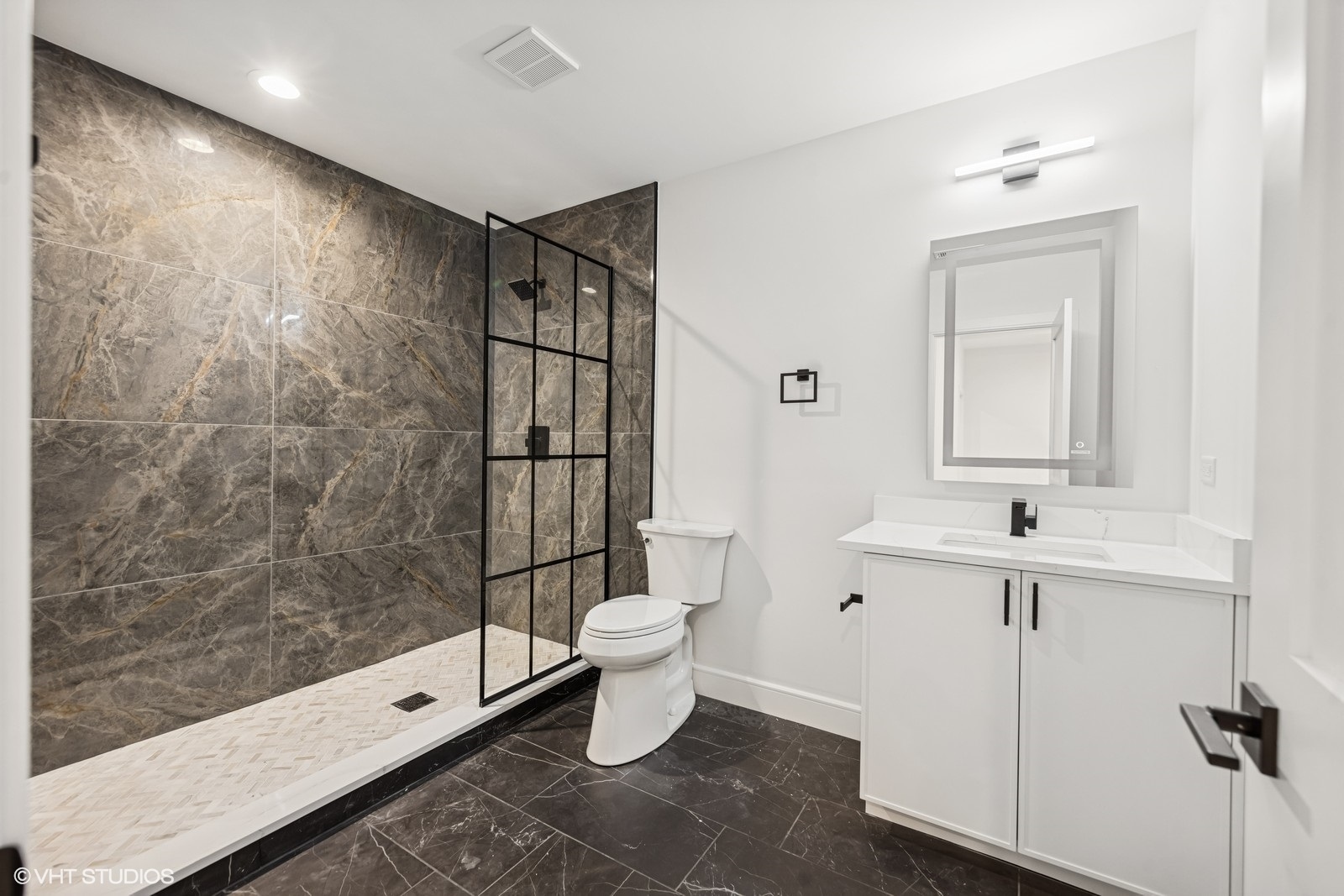 936 Mitchell Avenue Elmhurst, IL 60126 - Photo 34 of 44 a bathroom with a shower sink vanity mirror and toilet
