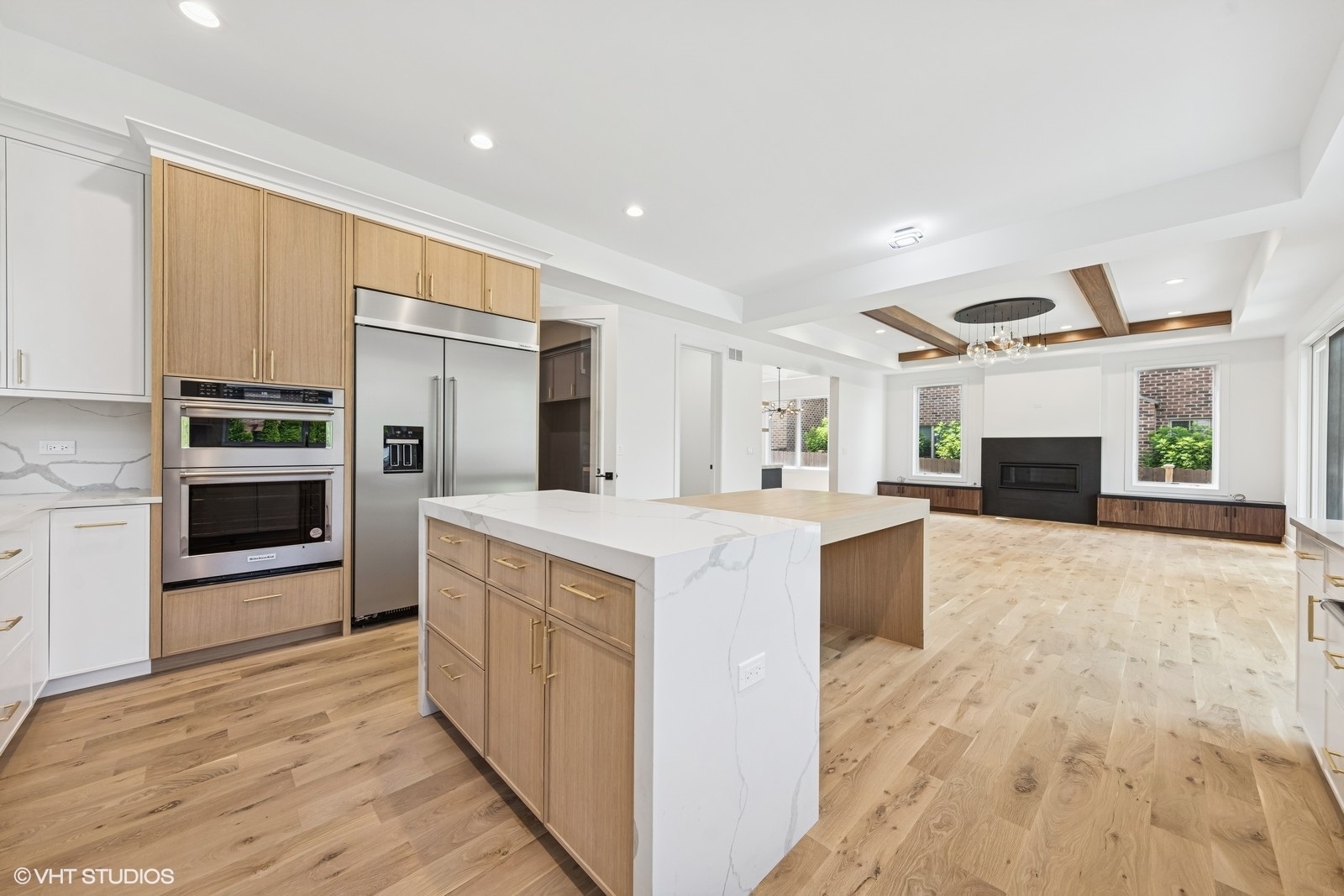 936 Mitchell Avenue Elmhurst, IL 60126 - Photo 5 of 44 a large kitchen with stainless steel appliances kitchen island granite countertop a refrigerator and a stove top oven