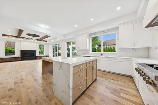 a kitchen with stainless steel appliances granite countertop a sink and cabinets