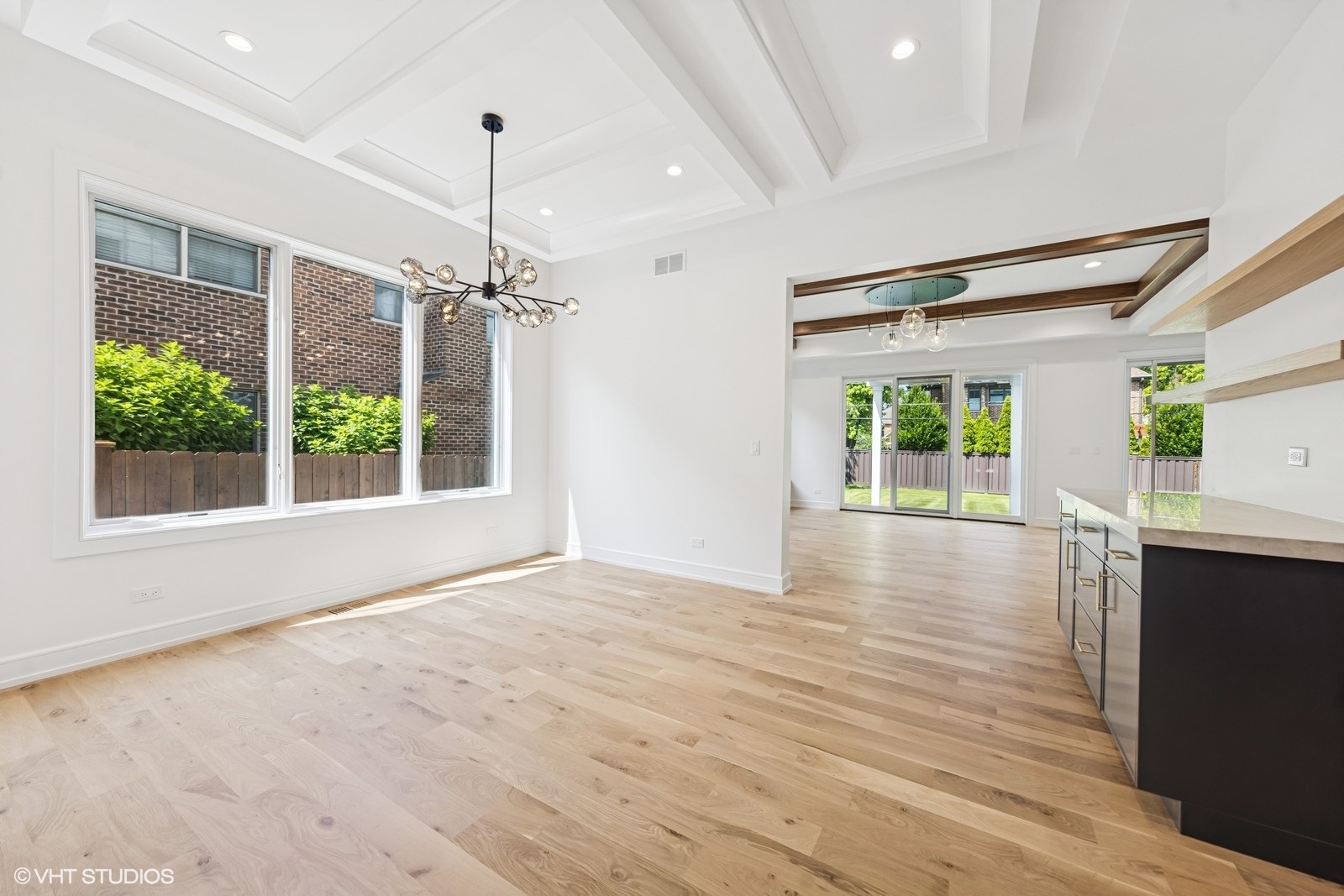 936 Mitchell Avenue Elmhurst, IL 60126 - Photo 8 of 44 a view of a room with wooden floor a ceiling fan and window