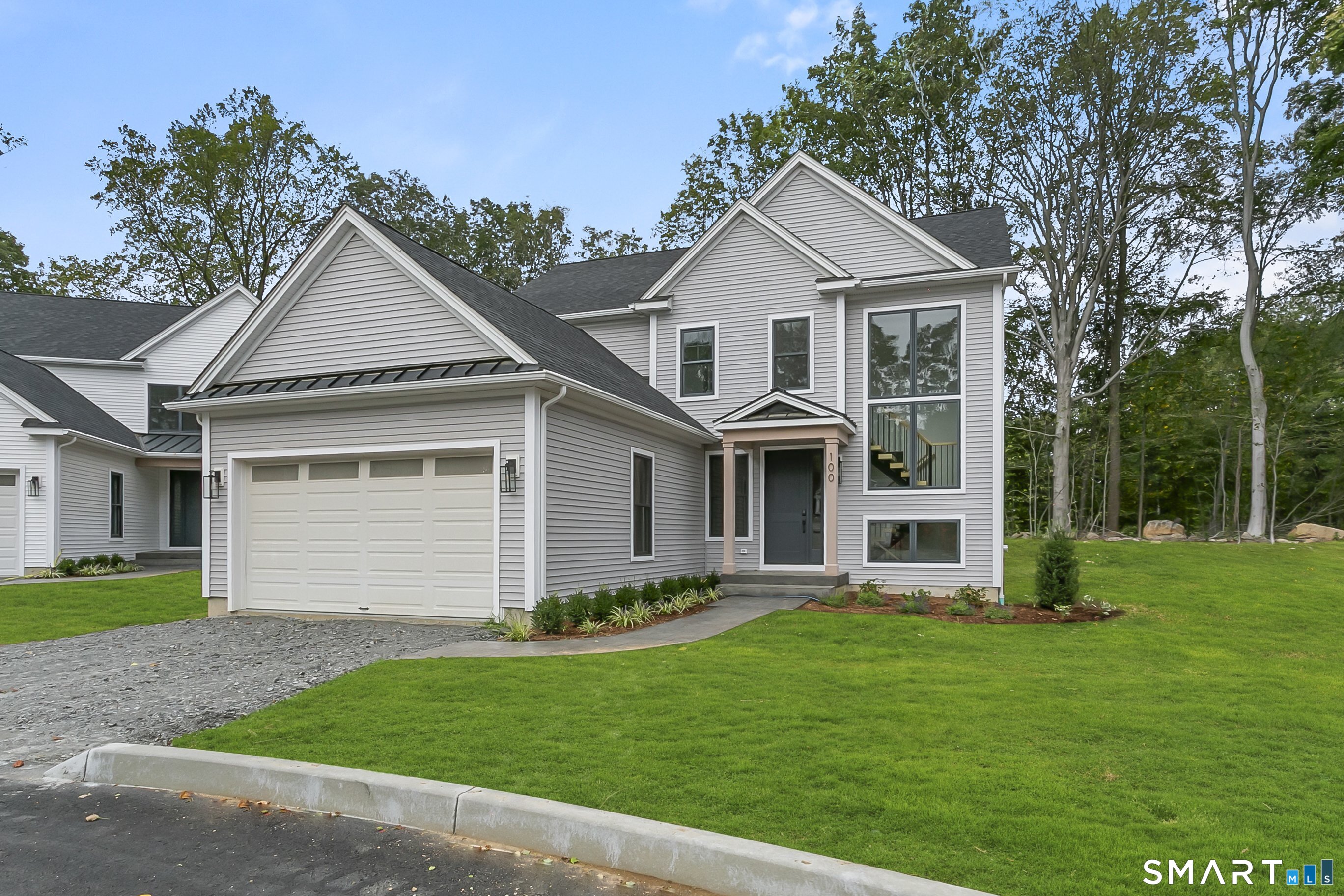 80 Oronoque Hills Road Stratford, CT 06614 - Photo 1 of 31 a front view of a house with a yard and garage