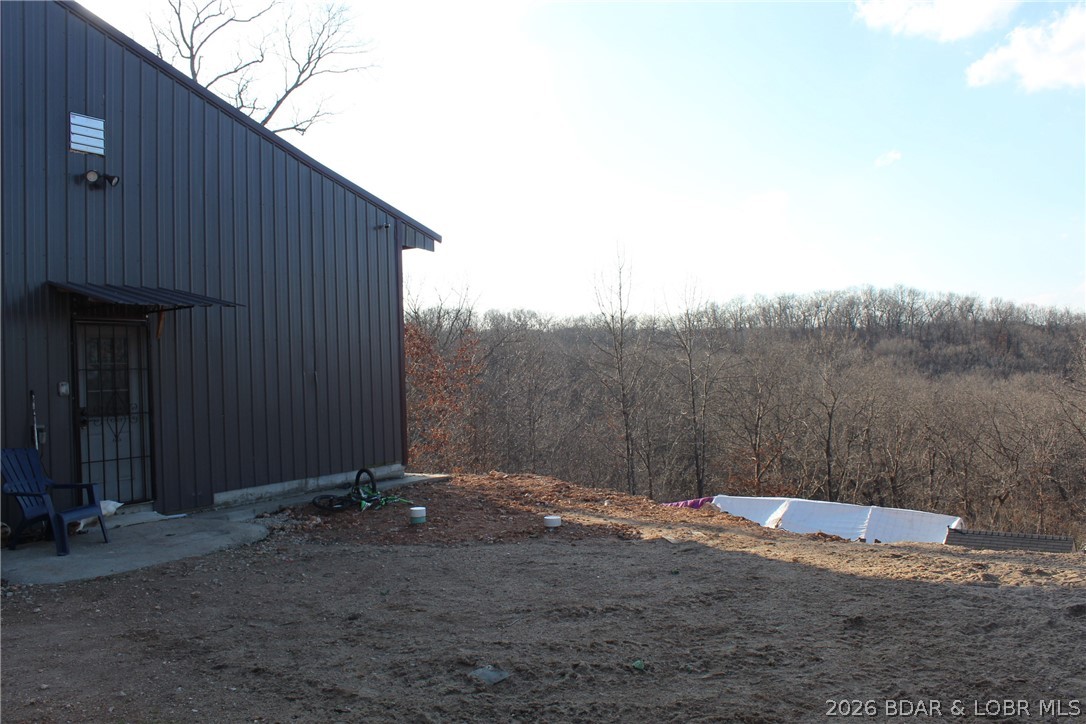 30932 Blackbird Road Stover, MO 65078 - Photo 27 of 53 Back side of the garage looking out at the land