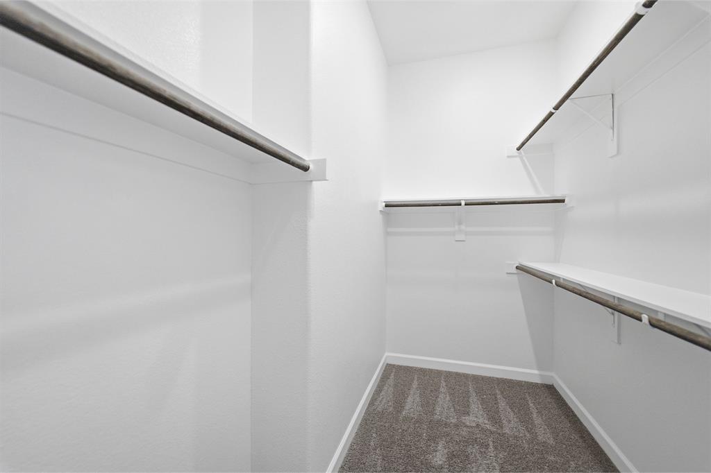 2020 Casting Ridge Mesquite, TX 75181 - Photo 24 of 34 Walk-in closet featuring multiple shelving units and hanging rods
