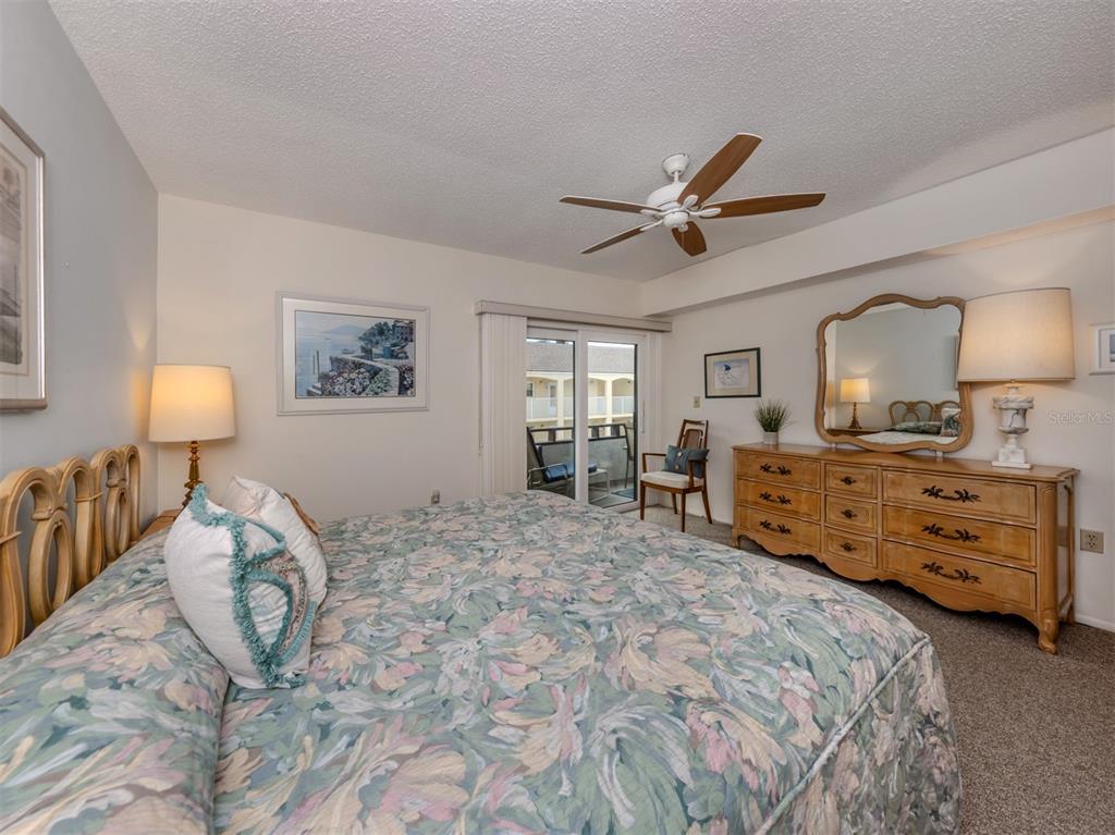 1555 Tarpon Center Drive, Unit 261 Venice, FL 34285 - Photo 17 of 50 a bed room with a bed and a view of bedroom