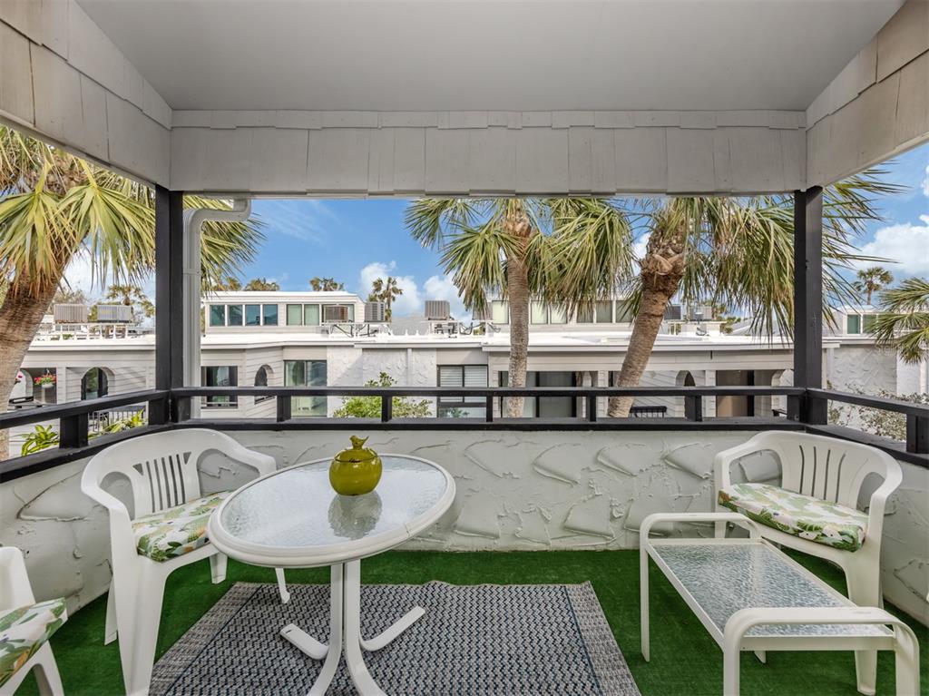 1555 Tarpon Center Drive, Unit 261 Venice, FL 34285 - Photo 25 of 50 a kitchen with a table chairs and a stove