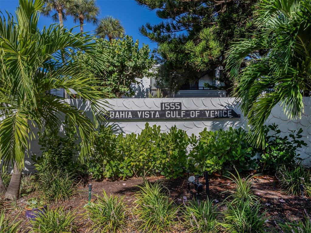 1555 Tarpon Center Drive, Unit 261 Venice, FL 34285 - Photo 26 of 50 a sign that is sitting in front of flowers