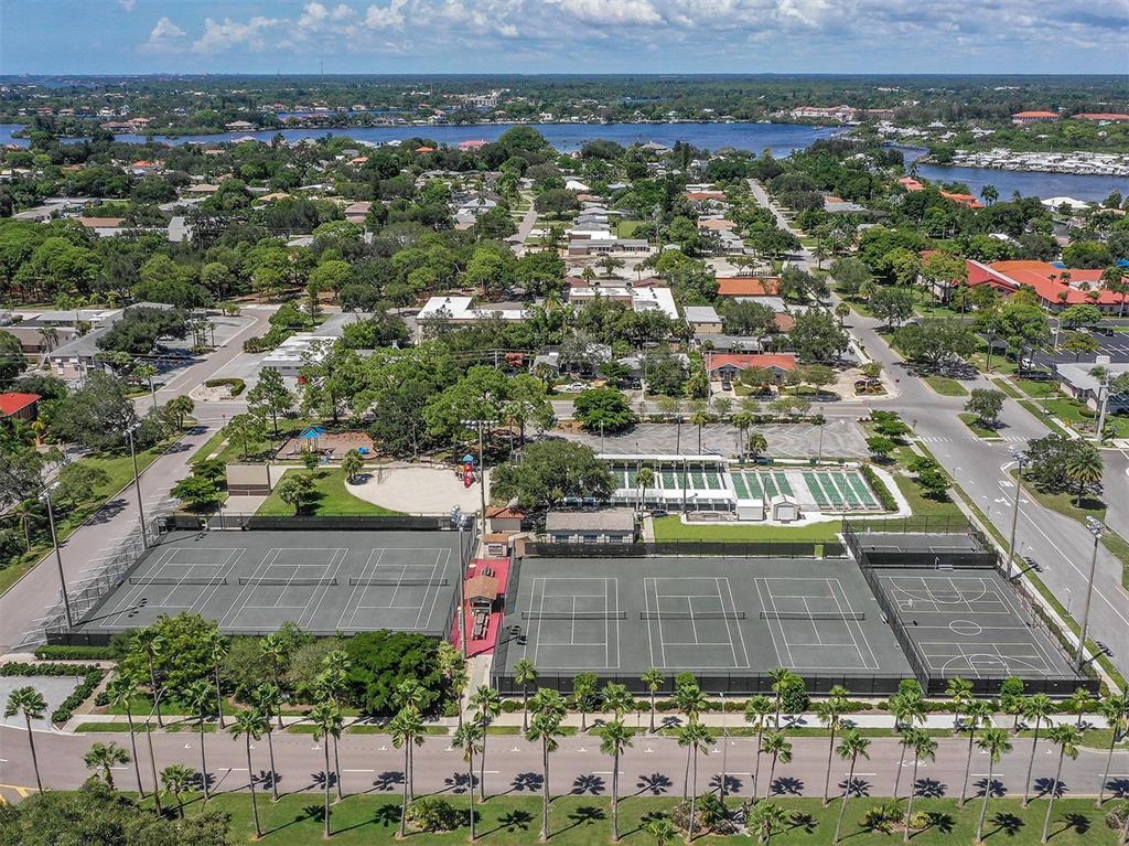 1555 Tarpon Center Drive, Unit 261 Venice, FL 34285 - Photo 43 of 50 an aerial view of residential houses with outdoor space and parking
