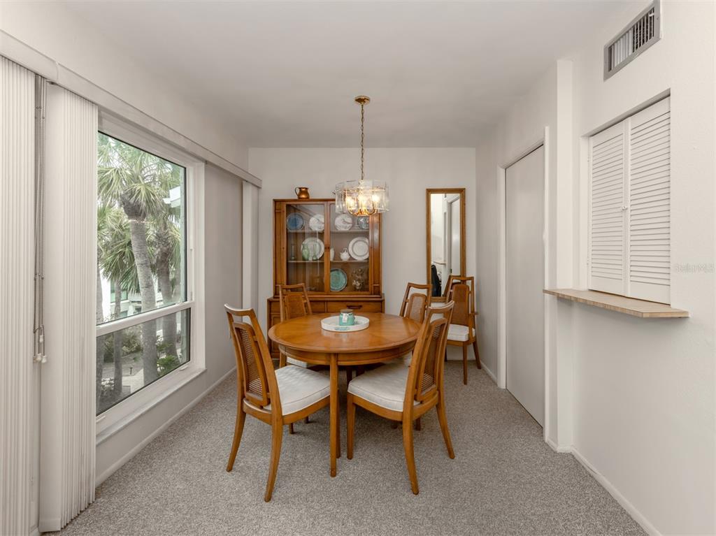 1555 Tarpon Center Drive, Unit 261 Venice, FL 34285 - Photo 7 of 50 a view of a dining room with furniture window and outside view