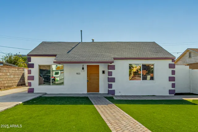 a aerial view of a house with a yard