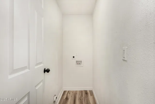 a view of bathroom with a sink and a window