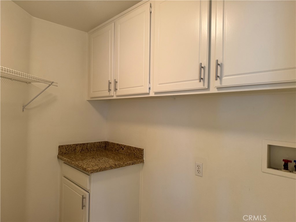 19562 Rotterdam Street Riverside, CA 92508 - Photo 11 of 11 a kitchen with a sink and cabinets