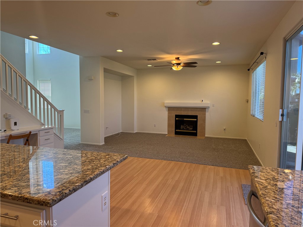 19562 Rotterdam Street Riverside, CA 92508 - Photo 5 of 11 a view of kitchen and hallway with wooden floor