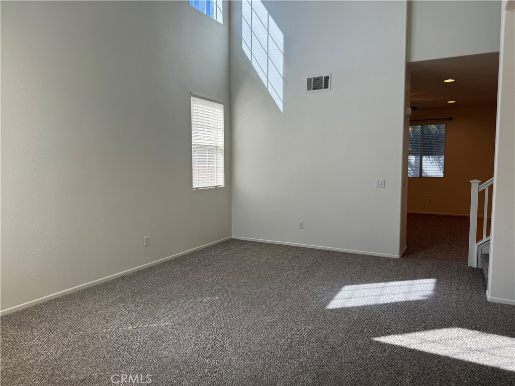 19562 Rotterdam Street Riverside, CA 92508 - Photo 7 of 11 an empty room with windows