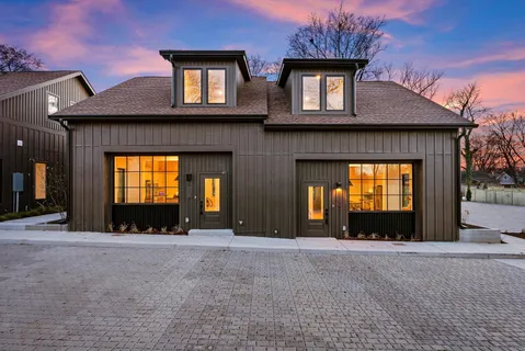 a view of a house with windows and a yard