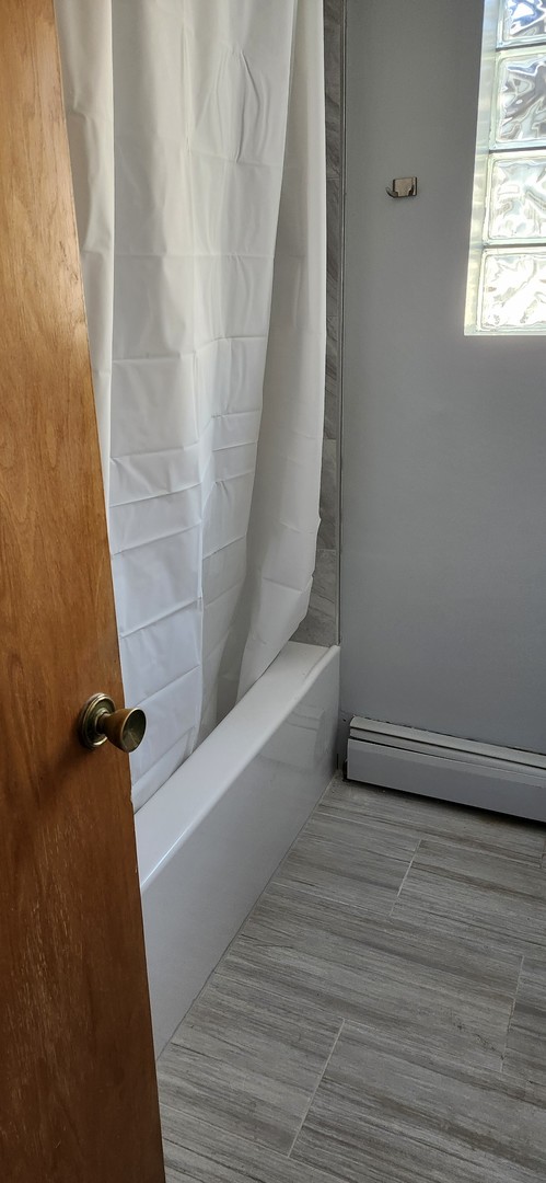 7824 West Addison Street, Unit 2 Chicago, IL 60634 - Photo 14 of 28 a view of bathroom with a window