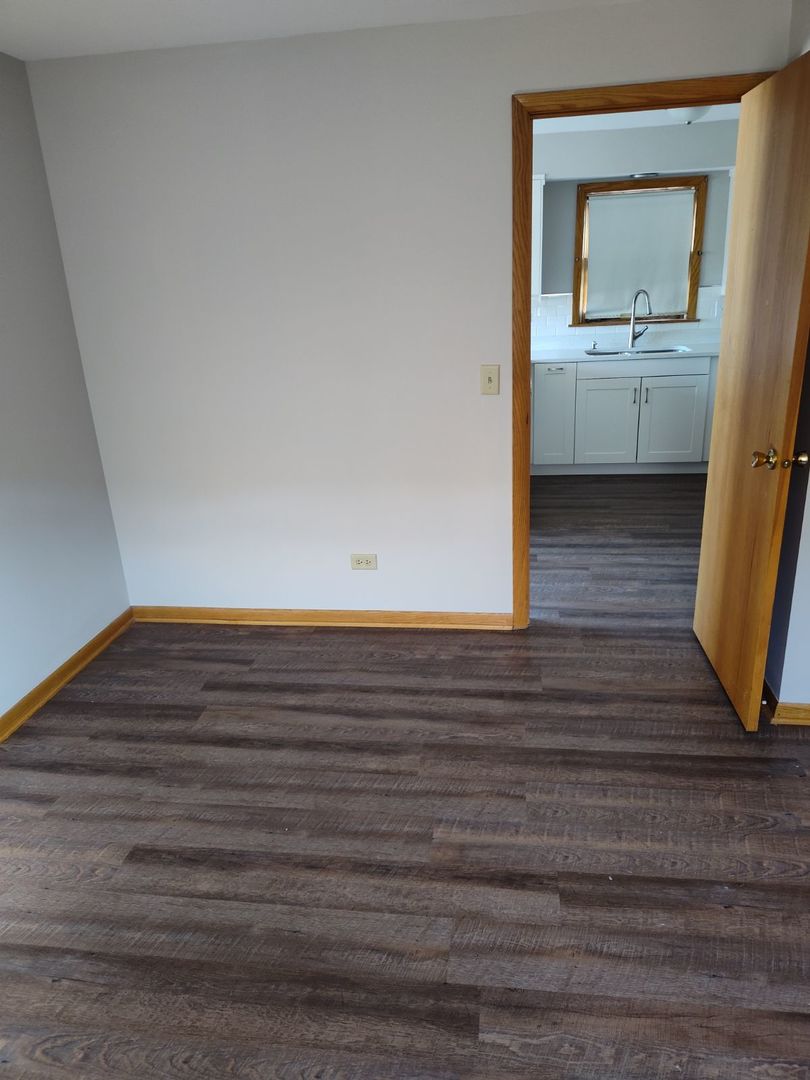 7824 West Addison Street, Unit 2 Chicago, IL 60634 - Photo 23 of 28 a view of room and front door