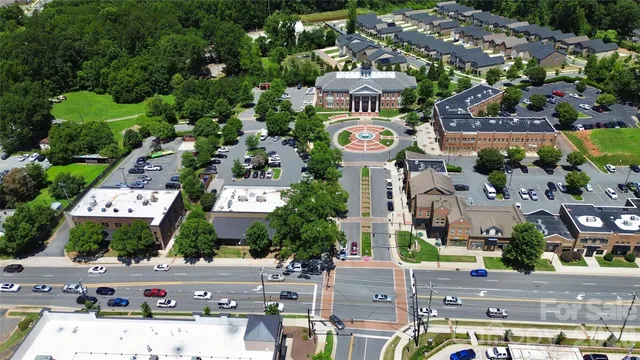 an aerial view of multiple houses with outdoor space