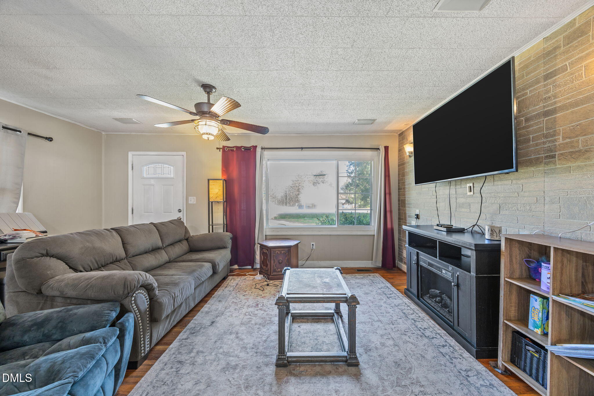 2727 Highway 87 Graham, NC 27253 - Photo 15 of 28 a living room with furniture and a flat screen tv