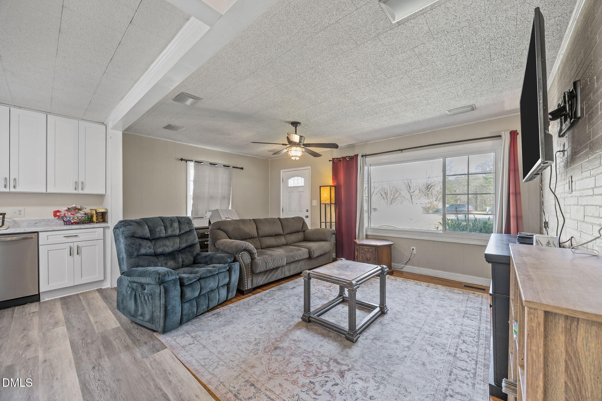 2727 Highway 87 Graham, NC 27253 - Photo 16 of 28 a living room with furniture and a flat screen tv