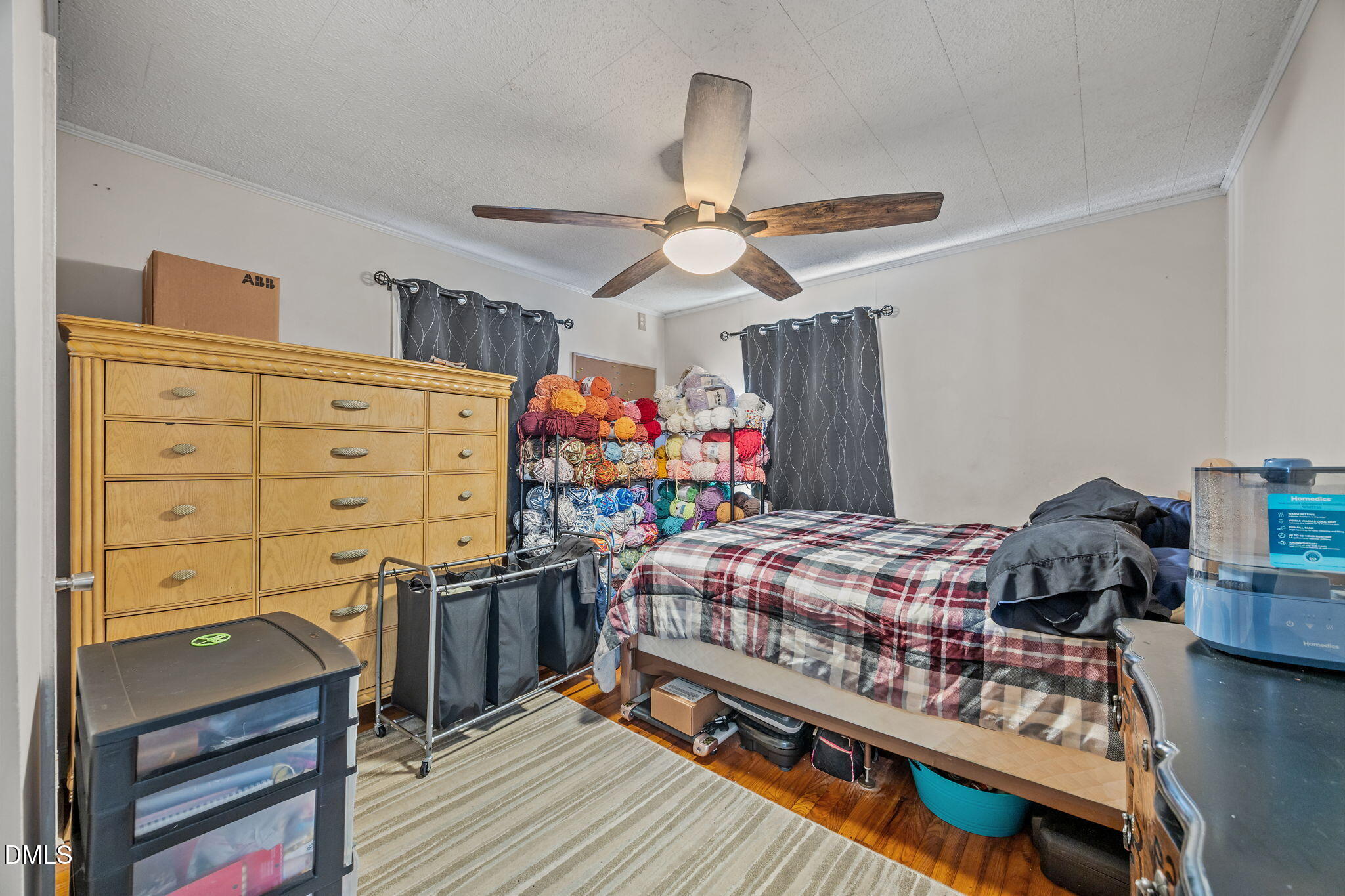 2727 Highway 87 Graham, NC 27253 - Photo 20 of 28 a bedroom with a bed and a chandelier