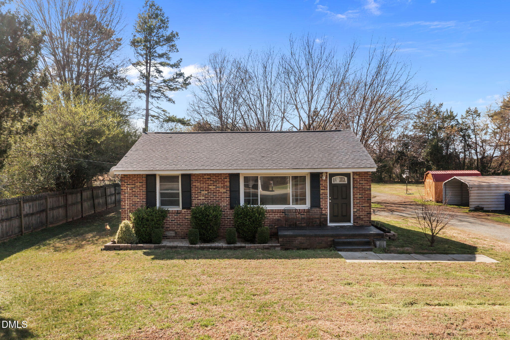 2727 Highway 87 Graham, NC 27253 - Photo 2 of 28 a house that has a tree in front of it